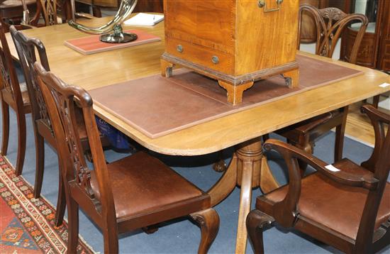 A George III style mahogany extending pedestal dining table, with twin pillars and single leaf, W.225cm